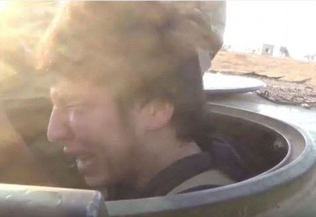 In tears: Despite his apparent fear of dying, Uzbek national Jafar al-Tayyar is told to drive an armoured vehicle packed with explosives into the besieged villages of Fua and Kafriyeh